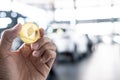 Asian man business holding tecnology bit coin in blurry office background. For business people, finance, lifestyle and ethereum or Royalty Free Stock Photo