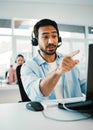 Asian man, call center and pointing in customer service, support or telemarketing at office. Businessman, consultant or Royalty Free Stock Photo