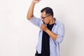 Asian Man Check his Armpit Smell. Isolated on white Royalty Free Stock Photo