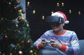 Asian Man With Christmas Costume Playing Virtual Reality Sitting