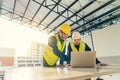 Asian man Civil Engineer and Contractor working with computer laptop on the table in construction site Royalty Free Stock Photo