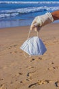 Used face mask on the beach with outdoor sun lighting. Royalty Free Stock Photo