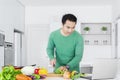 Asian man cooking vegetable Royalty Free Stock Photo