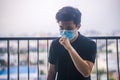 Asian man coughs and wears protective mask Royalty Free Stock Photo