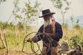 Asian Man Cowboy is catching a calf To be branded in ranch