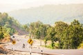 An asian man cyclist in hill climbing in the morning