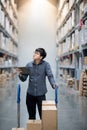 Asian man doing stocktaking on tablet in warehouse Royalty Free Stock Photo