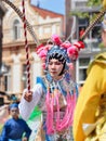 Asian man dressed in ancient Chinese opera costume participates in Tilburg T-parade, Netherlands