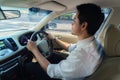 Asian man are driving on city streets to get to work in the morning Royalty Free Stock Photo
