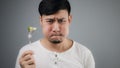 An Asian man eats broccoli. Royalty Free Stock Photo