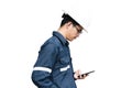 Asian man,Engineer or Technician in white helmet, glasses and bl Royalty Free Stock Photo