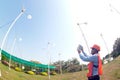 Asian man, engineer wearing a helmet Operate the wind turbine and take pictures with his phone. Ecology concepts and renewable. Royalty Free Stock Photo