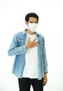 Asian man feel pain on lung and wear protective mask protect air pollution or transmissible infectious diseas and coronavirus or