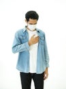 Asian man feel pain on lung and wear protective mask protect air pollution or transmissible infectious diseas and coronavirus or