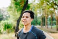 Asian man in fitness wear ruuning in park Royalty Free Stock Photo
