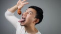 An Asian man with fried chicken. Royalty Free Stock Photo