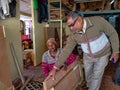 an asian man giving instructions to the carpenter for making furniture finishing at workshop in india January 2020