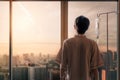 Asian man hand of a patient standing with medical drip or IV drip in hospital ward and look out at window with sunrise time, Royalty Free Stock Photo