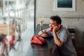 Asian man happy talk phone call in coffee shop Royalty Free Stock Photo