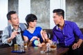 Asian man harassing woman in fancy nightclub Royalty Free Stock Photo