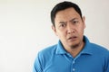 Asian Man Having Skeptical and Dissatisfied or Distrust Expression
