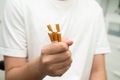 Asian man holding cigarette in hand, no smoking Royalty Free Stock Photo