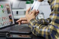 Asian man holding credit card and typing information on internet with laptop at home, online shopping concept Royalty Free Stock Photo