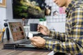 Asian man holding credit card and typing information on internet with laptop at home, online shopping concept Royalty Free Stock Photo