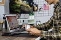 Asian man holding credit card and typing information on internet with laptop at home, online shopping concept Royalty Free Stock Photo