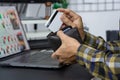 Asian man holding credit card and typing information on internet with laptop at home, online shopping concept Royalty Free Stock Photo