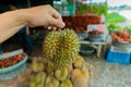 Asian man holding Durian is a king of fruit in Thailand and asia fruit Royalty Free Stock Photo