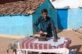 Asian man ironing clothes vintage iron