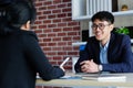 Asian man in job interview at office background, job search, business concept Royalty Free Stock Photo