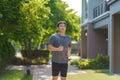Asian man are jogging in the neighborhood for daily health and well being, both physical and mental and simple antidote to daily Royalty Free Stock Photo