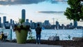 Asian man looking at Lake Ontario in from Toronto island in Canada