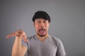 Asian man is making funny face. Royalty Free Stock Photo