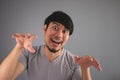 Asian man is making funny scary face. Royalty Free Stock Photo