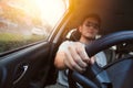 Asian man male ware sun glass drive a car.