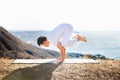 Asian man meditates in yoga position on high Royalty Free Stock Photo