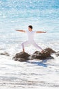 Asian man meditates in yoga position on high Royalty Free Stock Photo