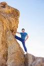 Asian man meditates in yoga position on high Royalty Free Stock Photo