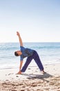 Asian man meditates in yoga position on high Royalty Free Stock Photo