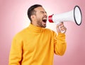 Asian man, megaphone and screaming for discount, sale or alert against a pink studio background. Male person shouting