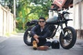 Asian man motorbike in black leather jacket travel rider trip. Handsome Men wear sunglass outdoor lifestyle freedom rider. Men Royalty Free Stock Photo