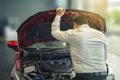 Asian man open door car with technology engine on blurry background.For automotive or Maintenance, service or transport Royalty Free Stock Photo