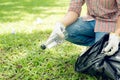 Asian man picking up plastic household waste in park Royalty Free Stock Photo