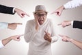 Asian Man Pointing Himself with Unhappy Expression Royalty Free Stock Photo