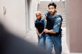 Asian man, police and gun running in city for suspect, investigation or catching criminal together. Serious male person Royalty Free Stock Photo