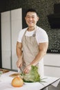 Asian man prepare dinner in a kitchen Royalty Free Stock Photo