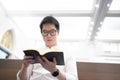 A man is reading the Holy Bible and praying in a worship room in a Christian church Royalty Free Stock Photo